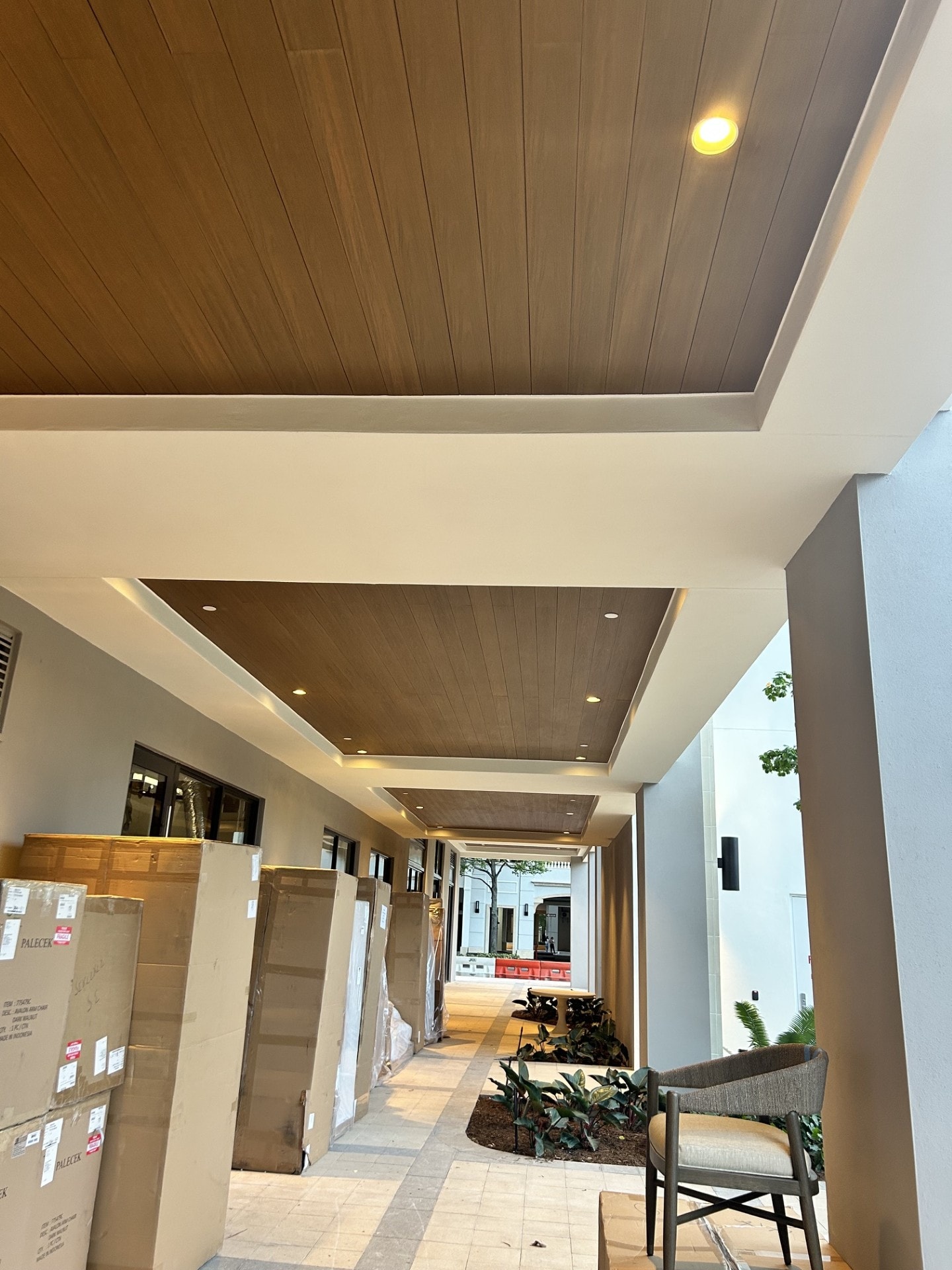 Finished wood ceiling and stucco corridor